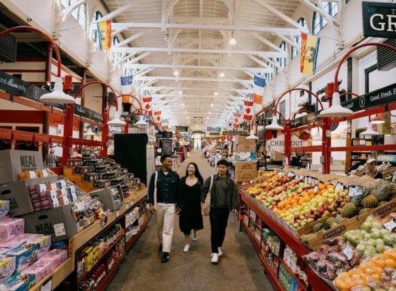 Group walking through St. John City Market