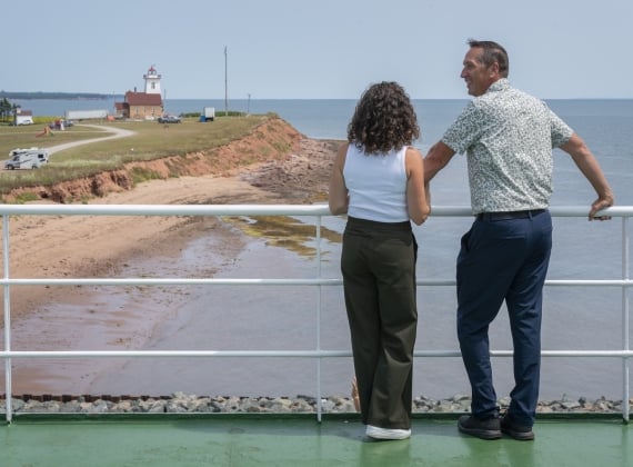 Two people on the deck of the MV Confederation